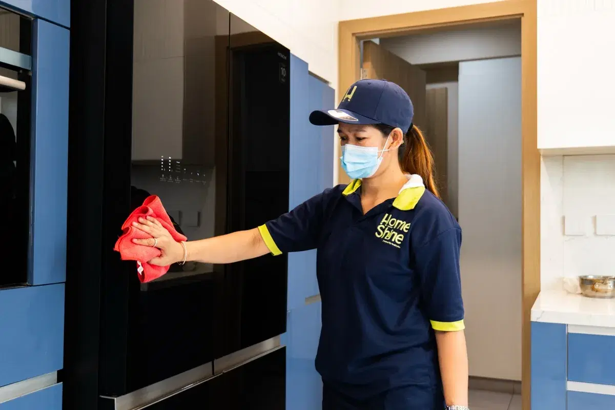 Wiping down kitchen appliance fronts